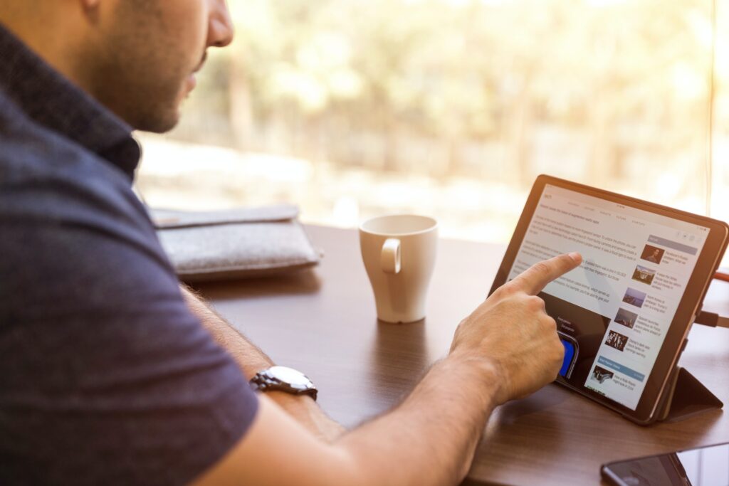 man typing on a computer screen