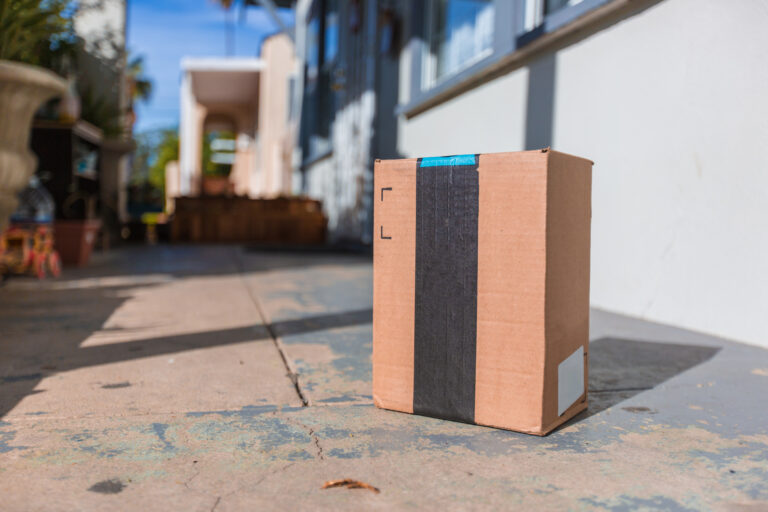cardboard box package delivered at doorstop